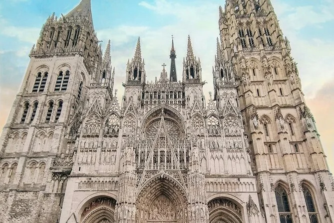 The Gothic west front of Rouen cathedral with its carved towers